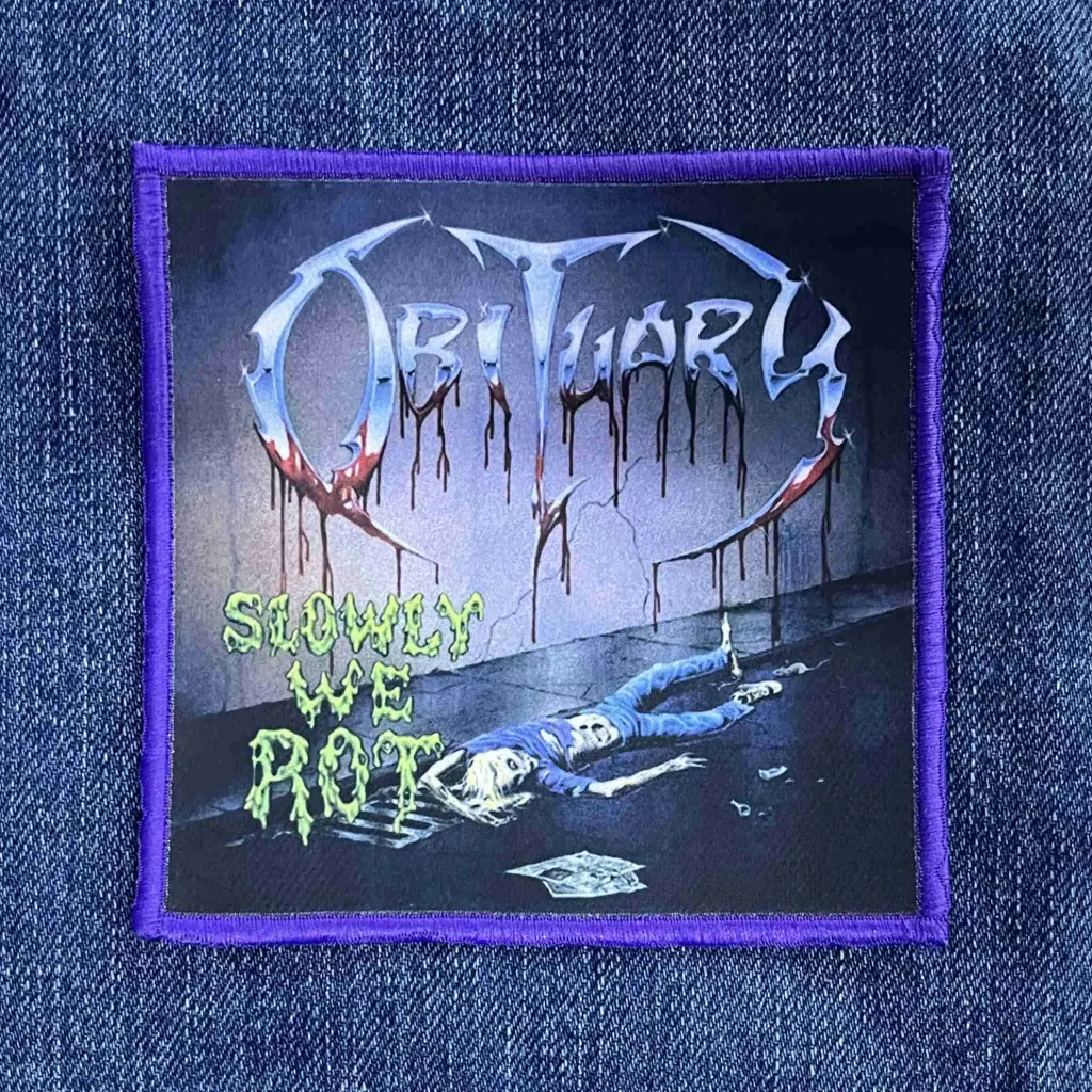 Нашивка Obituary - Slowly We Rot друкована фіолетова кайма