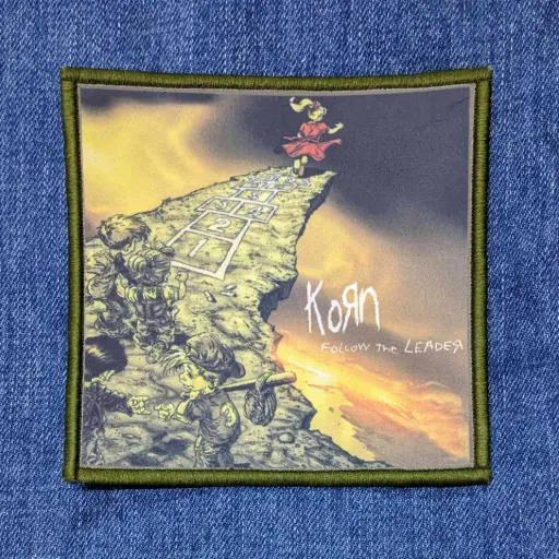 [310] Нашивка Korn - Follow The Leader друкована зелена кайма